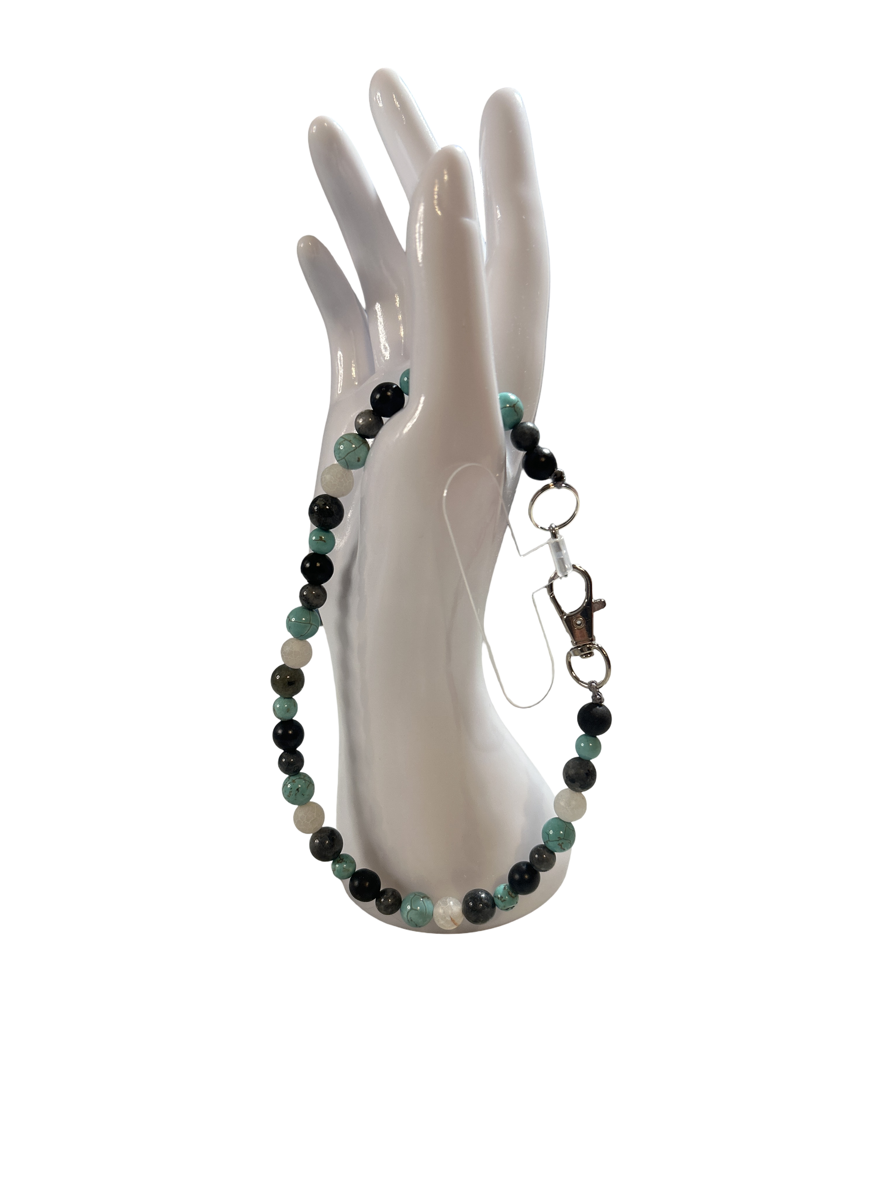 Attache cellulaire turquoise et Larvikite