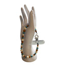 Attache cellulaire turquoise et pierre de lave blanche